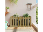 Raised garden bed with a designer fence made of impregnated pine wood